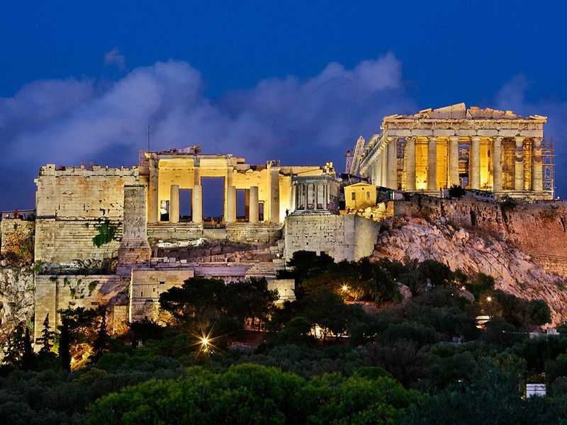 Афины какие. Экскурсия Акрополь в Афинах. Акрополь ЮНЕСКО. Акрополь Греция ЮНЕСКО. Вид на Акрополь в современных Афинах.